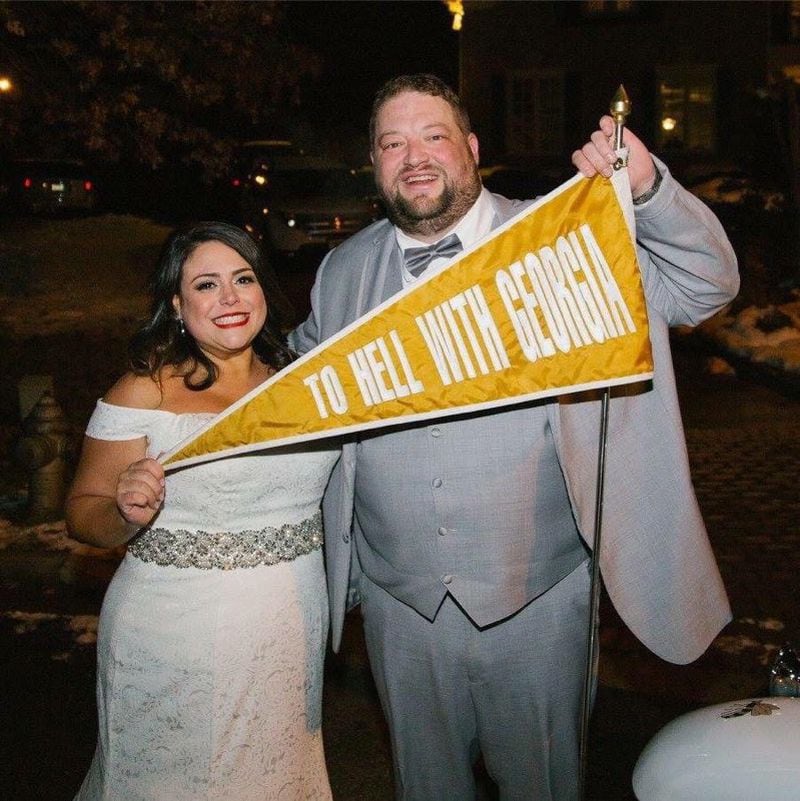 Laura and Bill Barlow at their wedding in December 2017 at the Cobb County home of James Herrin, a Tech grad and donor. The wedding had to be moved from the original location because of a snowstorm, and Herrin became ordained and performed the wedding. The Ramblin' Wreck still made it. (Contributed by Bill Barlow)