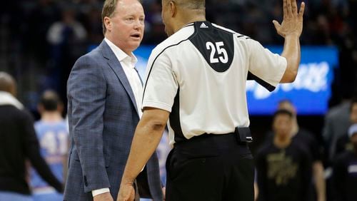 Atlanta Hawks head coach Mike Budenholzer, left, questions referee Tony Brothers about a call during the second half of an NBA basketball game against the Sacramento Kings Friday, Feb. 10, 2017, in Sacramento, Calif. The Kings won 108-107. (AP Photo/Rich Pedroncelli)
