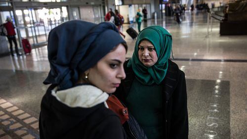 Noor Mohanad Majbal, 21, and her mother Nagham Abd Alstaar, refugees from Iraq, wait for their family to collect their luggage after arriving at Austin-Bergstrom International Airport on Feb. 15, 2017. The family was initially denied entry into the U.S. because of President Trump’s first travel ban. (Tamir Kalifa/ AMERICAN-STATESMAN)
