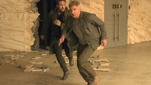 Ryan Gosling, left, and Harrison Ford star “Blade Runner 2049.” Contributed by Stephen Vaughan/Warner Bros. Pictures via AP