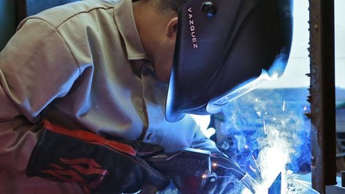 Nov. 13, 2015 - Jesus Vazquez works on a MIG welding assignment in welding lab. The Lanier Charter Career Academy student was taking a welding class at nearby Lanier Technical College. BOB ANDRES / BANDRES@AJC.COM
