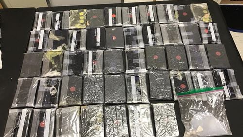 Two people are in custody after about 10 pounds of heroin was seized.