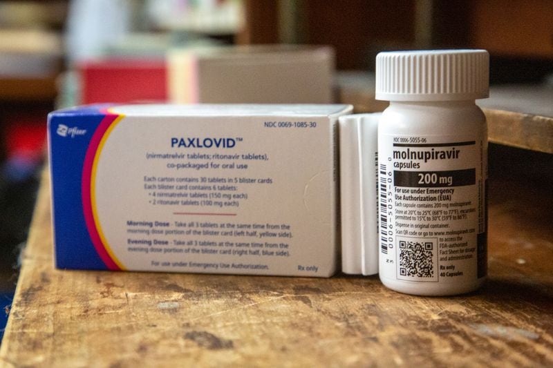 The two new antivirals - molnupiravir and Paxlavoid, sit on the counter of Chapman Drug, a pharmacy in Hapeville, Thursday, February 3, 2022.    STEVE SCHAEFER FOR THE ATLANTA JOURNAL-CONSTITUTION