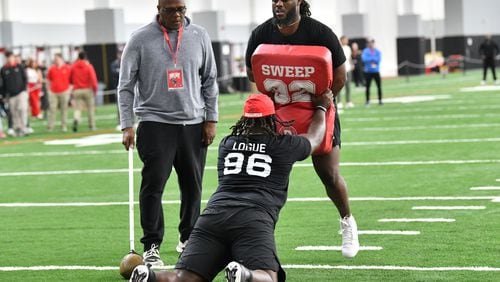 Georgia defensive lineman Zion Logue and Georgia defensive lineman Tramel Walthour team up to run football drills in front of coaches and scouts during Georgia Pro Day at Payne Indoor Athletic Facility, Wednesday, Mar. 13, 2024, in Athens. (Hyosub Shin / Hyosub.Shin@ajc.com)