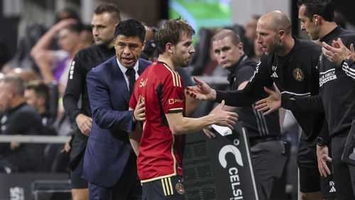 Atlanta United head coach Gonzalo Pineda greets Atlanta United midfielder Saba Lobjanidze (9) as he comes off of the field during the second half of their game against the New England Revolution at Mercedes-Benz Stadium, Saturday, March 9, 2024, in Atlanta. Atlanta United won 4-1. (Jason Getz / jason.getz@ajc.com)
