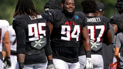 080522 Flowery Branch, Ga.: Atlanta Falcons defensive tackle Anthony Rush (94) talks with defensive tackle Ta'Quon Graham (95) during training camp at the Falcons Practice Facility, Friday, August 5, 2022, in Flowery Branch, Ga. (Jason Getz / Jason.Getz@ajc.com)