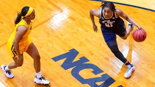 Georgia Tech guard Kierra Fletcher (41) drives around West Virginia guard Kirsten Deans during the first half of their second-round women's NCAA Tournament game Tuesday, March 23, 2021, at the Convocation Center in San Antonio. (Stephen Spillman/AP)