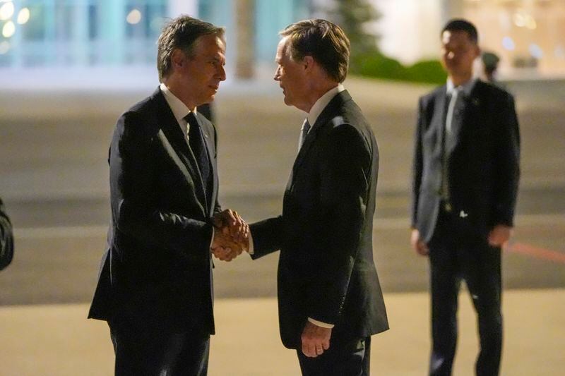 U.S. Secretary of State Antony Blinken shakes hands with US ambassador to China Nicholas Burns as he prepares to return to the U.S. following a visit to China, Friday, April 26, 2024, at Beijing Capital International Airport in Beijing, China. (AP Photo/Mark Schiefelbein, Pool)