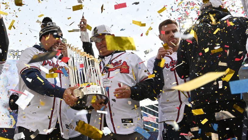 The Braves, led by manager Brian Snitker and first baseman Freddie Freeman, celebrate the one prize they all can share - the World Series Trophy - during a confetti-strewn affair at Truist Park. (Hyosub Shin / Hyosub.Shin@ajc.com)