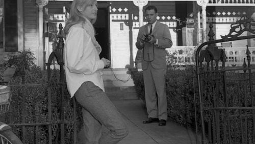 The film adaptation of Carson McCullers' "The Heart is a Lonely Hunter" was released in 1968 to great acclaim. The AJC's Floyd Jillson was there for filming in Selma, Ala., and shot a series of behind the scenes shots. Here, actor Alan Arkin (right) takes photographs of co-star Sondra Locke (front) on the set. Arkin and Locke both earned Oscar nominations for their roles. FLOYD JILLSON / AJC PHOTO ARCHIVES
