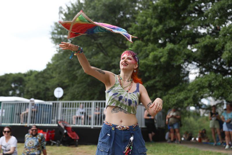 Libby Seger dances with a spinning cloth as Ax and the Hatchetmen perform on the Piedmont stage at Shaky Knees. (Riley Bunch/The Atlanta Journal-Constitution)