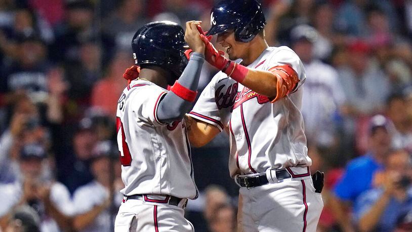Atlanta Braves' Vaughn Grissom, right, is congratulated by Michael Harris II after his two-run home run against the Boston Red Sox during the seventh inning of a baseball game Wednesday, Aug. 10, 2022, in Boston. (AP Photo/Charles Krupa)