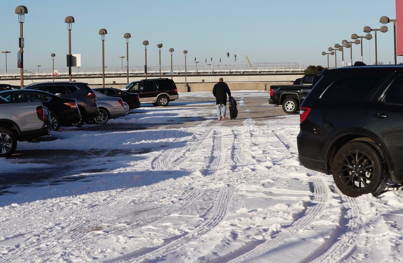 Snow still tops an upper parking deck at Hartsfield-Jackson International Airport. BOB ANDRES / BANDRES@AJC.COM