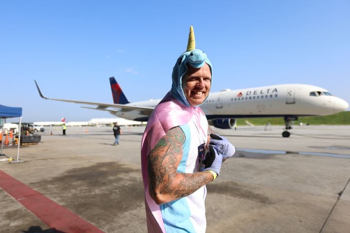 Kevin Johnson from Delta Fly Products poses after finishing dragging the 757 airplane with the "Widget Woman" team during the fundraising Relay for Life and Jet Drag event on Wednesday, May 4. 2022. Miguel Martinez / miguel.martinezjimenez@ajc.com