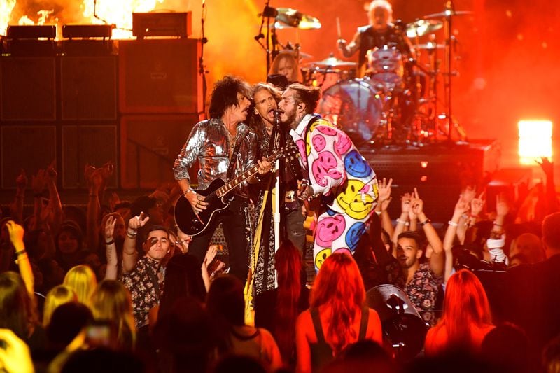 Post Malone (right) has a blast onstage with Aerosmith at the VMAs.