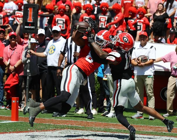 Georgia wide receiver Colbie Young catches a touchdown pass over defensive back Julian Humphrey for a 10-7 lead during the second quarter of the G-Day game on Saturday, April 13, 2024.  Curtis Compton for the Atlanta Journal Constitution
