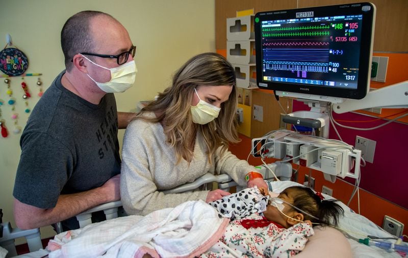 Tamara and Justin Harris take turns sitting for 24-shifts in the ICU with Rynli while the spouse stays with their older children. STEVE SCHAEFER FOR THE ATLANTA JOURNAL-CONSTITUTION