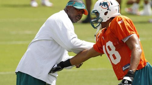 New Falcons defensive line coach Bryan Cox. Miami Dolphins pass rush coach Bryan Cox, left, does drills with linebacker Quinton Spears during NFL football practice at training camp in Davie, Fla. Tuesday, Aug. 16, 2011. Lynne Sladky, Associated Press