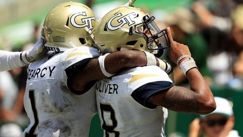 TAMPA, FL - SEPTEMBER 08:  Tobias Oliver #8 of the Georgia Tech Yellow Jackets celebrates a touchdown during a game against the South Florida Bulls at Raymond James Stadium on September 8, 2018 in Tampa, Florida.  (Photo by Mike Ehrmann/Getty Images)