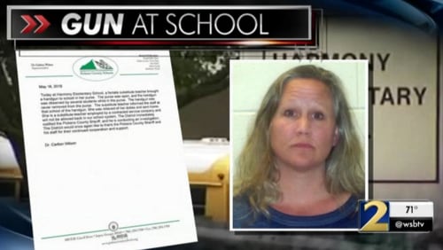 Julie Gungle was arrested for taking a gun into an elementary school, authorities said.