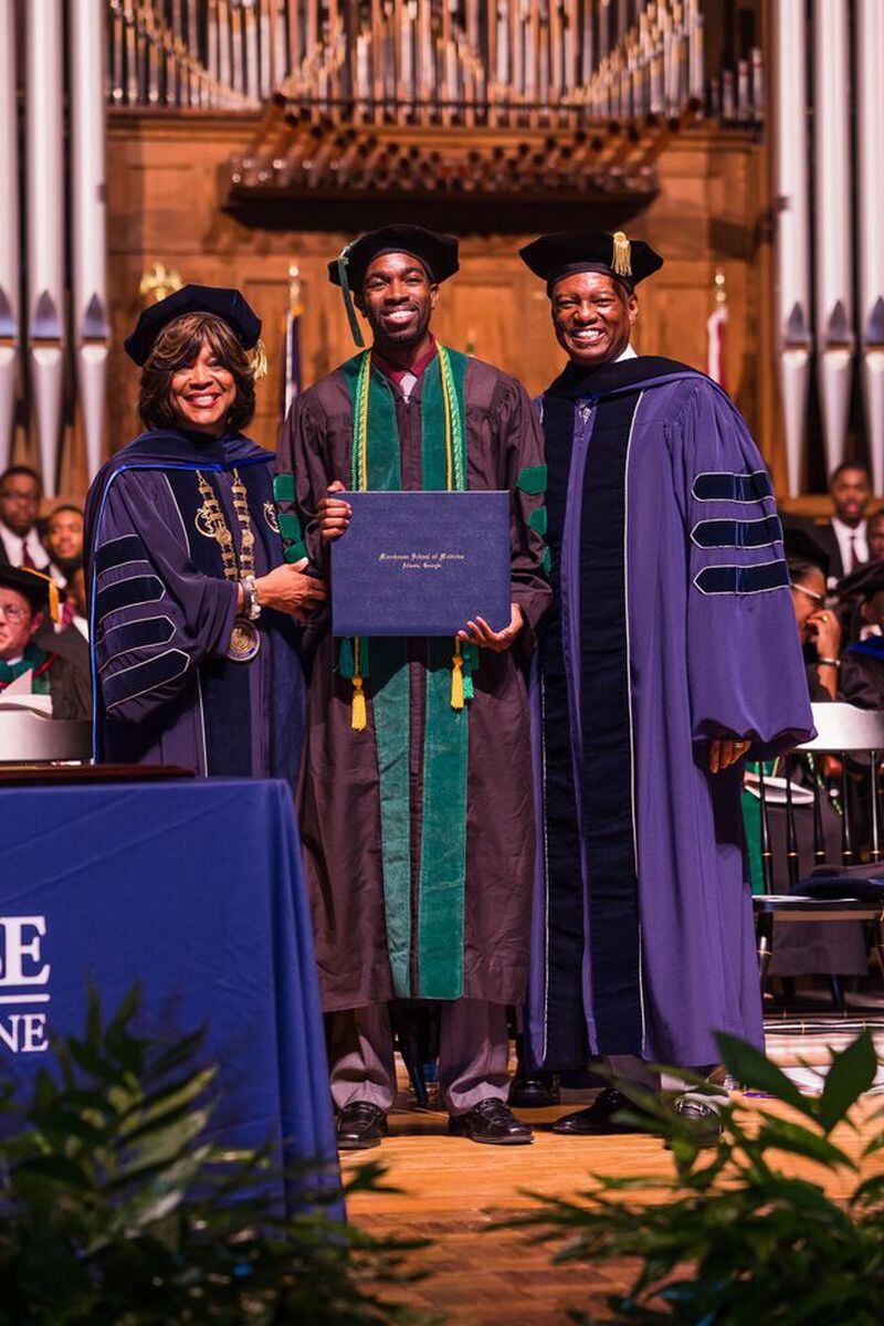 Dr. Davon Thomas, center, with Morehouse Medical School President and Dean Valerie Montgomery Rice, and Chairman of MSM's Board of Trustees Art Collin. (Photo/Morehouse)