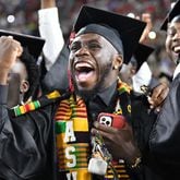 University of Georgia graduates react before they move their tassels during the 2022 Spring Undergraduate Commencement at Sanford Stadium in Athens on on Friday, May 13, 2022. (Hyosub Shin / Hyosub.Shin@ajc.com)