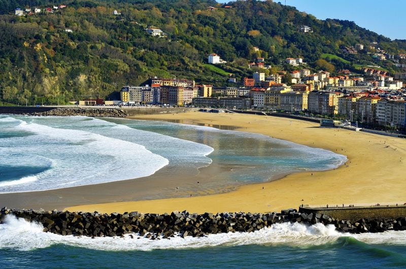 Zurriola Beach and Urumea River mouth in San Sebastian, Spain. Spanish tourism officials are optimistic that the country will have the proper protocols in place to welcome back travelers from all over the world by this summer. (Juan Moyano/Dreamstime/TNS)