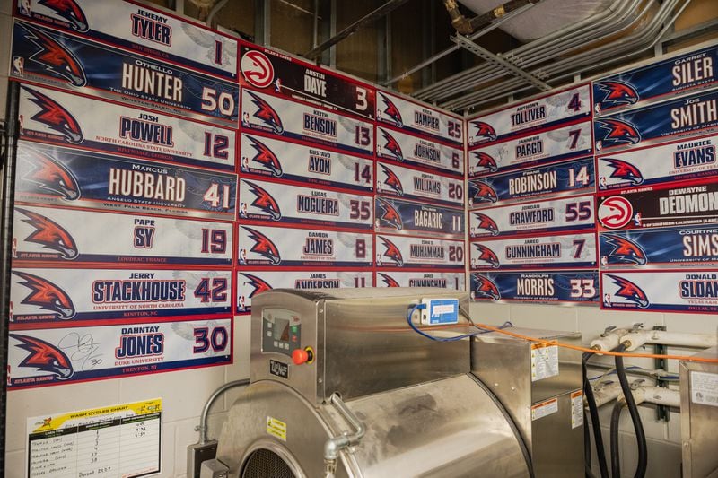Inside the Atlanta Hawks laundry room are name plates from past players taken on Saturday, March 30, 2024, in Atlanta, at State Farm Arena. (Atlanta Journal-Constitution/Jason Allen)