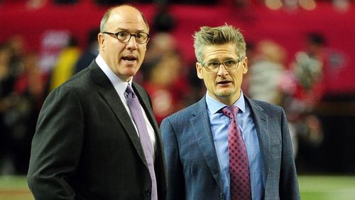 Thomas Dimitroff, general manager for the Atlanta Falcons, speaks to his assistant general manager, Scott Pioli, prior to the game against the Tampa Bay Buccaneers at the Georgia Dome on Nov. 1, 2015 in Atlanta, Georgia. (Photo by Scott Cunningham/Getty Images)