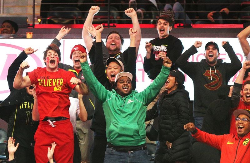 Members of the 6th Man Section show their love for the Hawks while their team plays against the Raptors in an NBA game on Jan. 24, 2018, in Atlanta. CURTIS COMPTON / CCOMPTON@AJC.COM