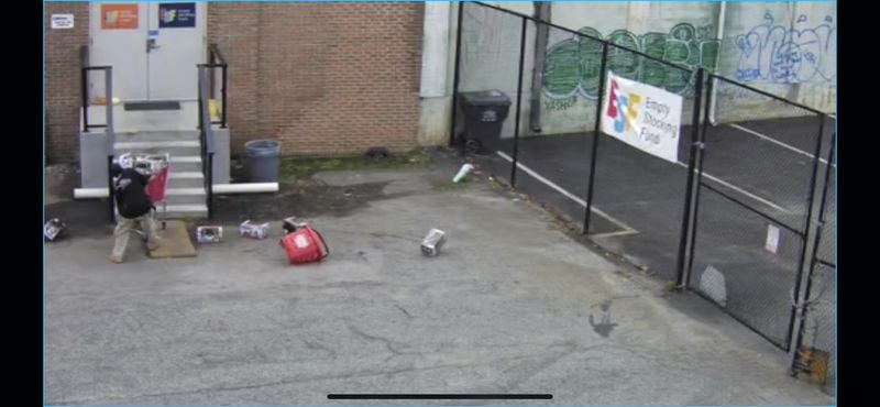 This surveillance video image from the Empty Stocking fund warehouse shows the a bandit stealing a cart full of toys from the  nonprofit's southwest Atlanta warehouse in November. Authorities believe the same man has been hitting the nonprofit's warehouse the past two holiday seasons. This image from Nov. 6 was one of five break-ins authorities believe the man did at the warehouse that weekend. (Credit: the Empty Stocking Fund.)