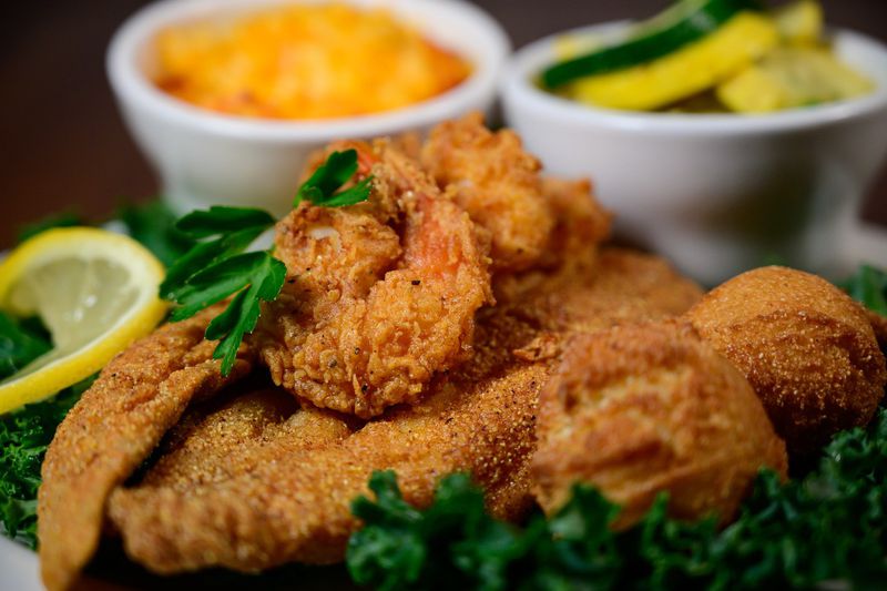 Who’s Got Soul Southern Cafe offers fried seafood, such as this plate with fried catfish, shrimp, hushpuppies and sides of macaroni and cheese and sautéed zucchini and yellow squash.
Courtesy of Who’s Got Soul Southern Café