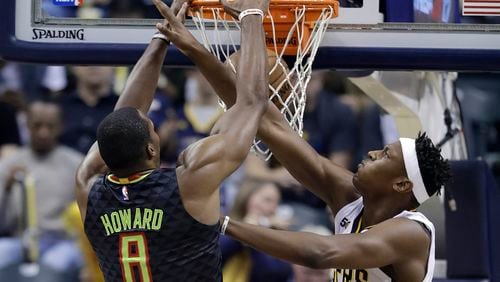 Atlanta Hawks’ Dwight Howard (8) dunks against Indiana Pacers’ Myles Turner during the first half of an NBA basketball game Wednesday, Nov. 23, 2016, in Indianapolis. (AP Photo/Darron Cummings)