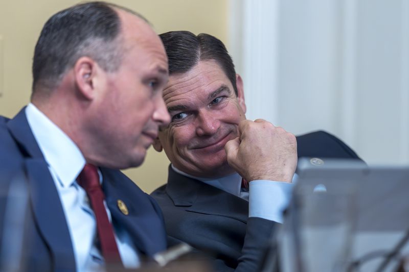 Rep. Nicholas Langworthy, R-N.Y., left, and Rep. Austin Scott, R-Ga., confer during a House Rules Committee meeting this week in Washington.