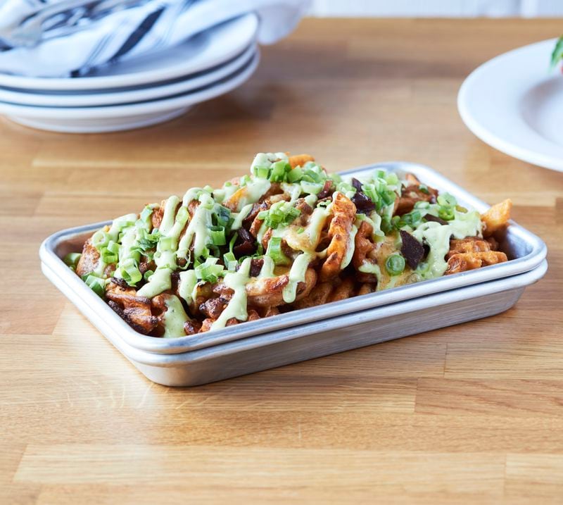Emmy Squared's Zia Fries are waffle potatoes loaded with Hatch Chilli cheese, green onions, bacon and ranch.  (Courtesy of Emmy Squared Pizza)