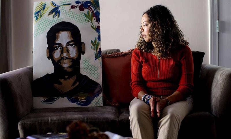 Lucia McBath looks at artwork someone made with an image of her 17-year-old son Jordan Davis, who was fatally shot outside of a Florida convenience store in November 2012 for playing music too loud, Thursday, Nov. 17, 2016, in Marietta, Ga. BRANDEN CAMP/SPECIAL