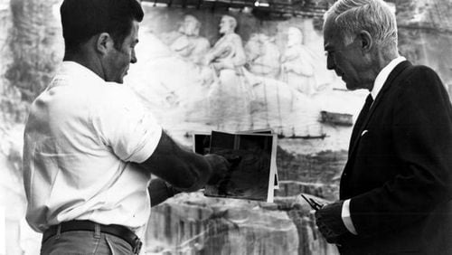 Roy Faulkner, left, joined the Stone Mountain team in 1962 and quickly became chief carver, despite having no artistic training whatsoever. FILE PHOTO
