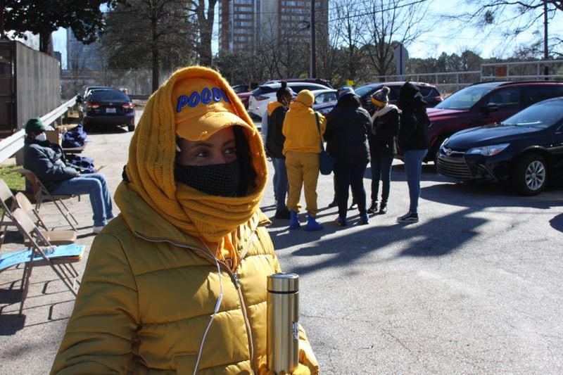 Sylvia Cook, who pledged Sigma Gamma Rho in 1989 at Cheyney University, takes a break from registering Vine City residents in line to get vaccinated at a Covid-19 drive-thru event sponsored by the sorority at West Mitchell CME Church on Feb. 19, 2022.