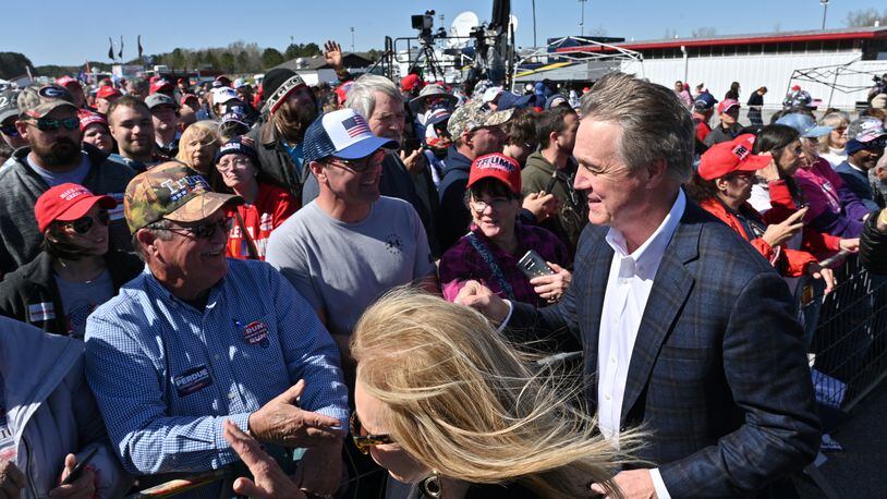 March 26, 2022 Commerce - David Perdue walks in during a rally for Georgia GOP candidates at Banks County Dragway in Commerce on Saturday, March 26, 2022. (Hyosub Shin / Hyosub.Shin@ajc.com)