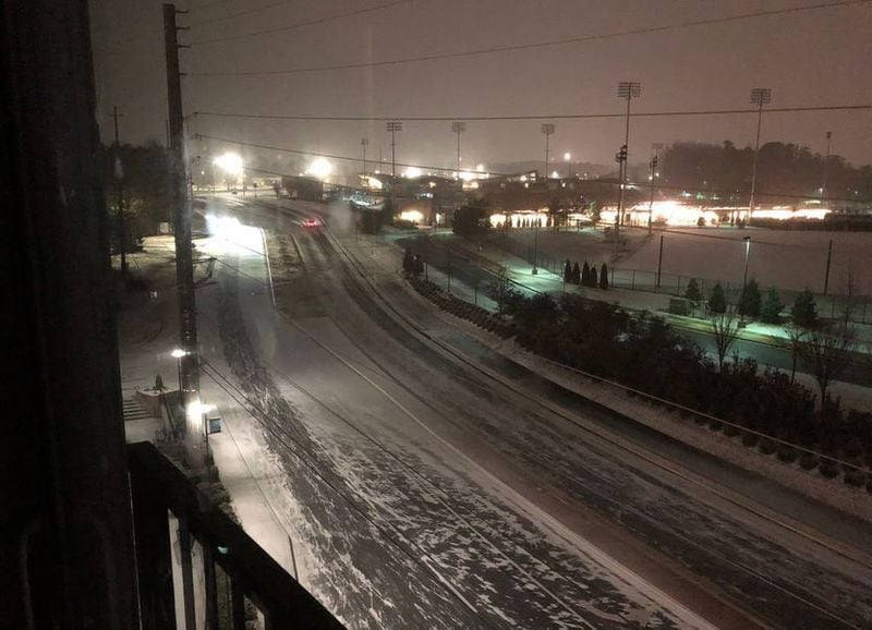 Snow was on the roads in Kennesaw on Tuesday night. (Credit: Ryan Wood via Channel 2 Action News)