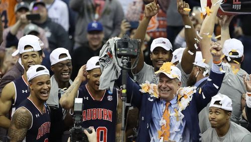 Head coach Bruce Pearl and the rest of the Auburn Tigers celebrate after beating Kentucky and earning a spot in the Final Four. (Photo by Christian Petersen/Getty Images)