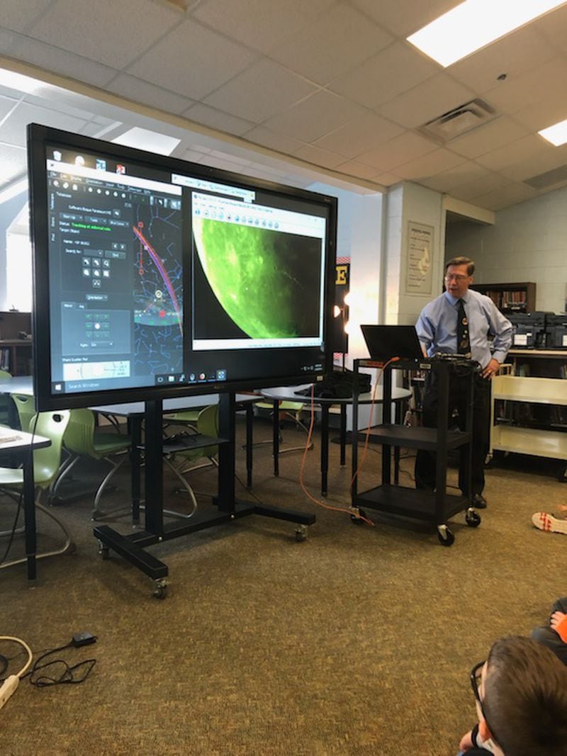 With Tom Crowley controlling the telescope, Jim Sowell shows a live view of the Moon to fourth graders at Barnwell Elementary School in 2019. Courtesy of the Jim Sowell
