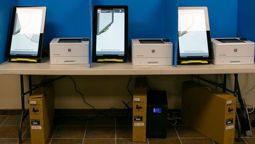 New polling machines wait to be used in October at the Paulding County Municipal Building in Dallas, Ga. Paulding was one of six counties that tested the new machines in last month’s municipal elections. (Photo/Rebecca Wright for the Atlanta Journal-Constitution)