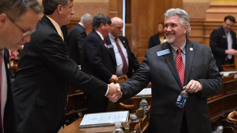 February 19, 2016 Atlanta: Sen Marty Harbin-R , left, congratulates Sen. Greg Kirk-R on the passage of HB 757 Friday February 19, 2016. The bill enables faith-based organizations and individuals to opt out of serving couples — gay, straight or unmarried — or following anti-discrimination requirements if they cite a sincerely held religious belief or moral conviction regarding marriage. BRANT SANDERLIN/BSANDERLIN@AJC.COM