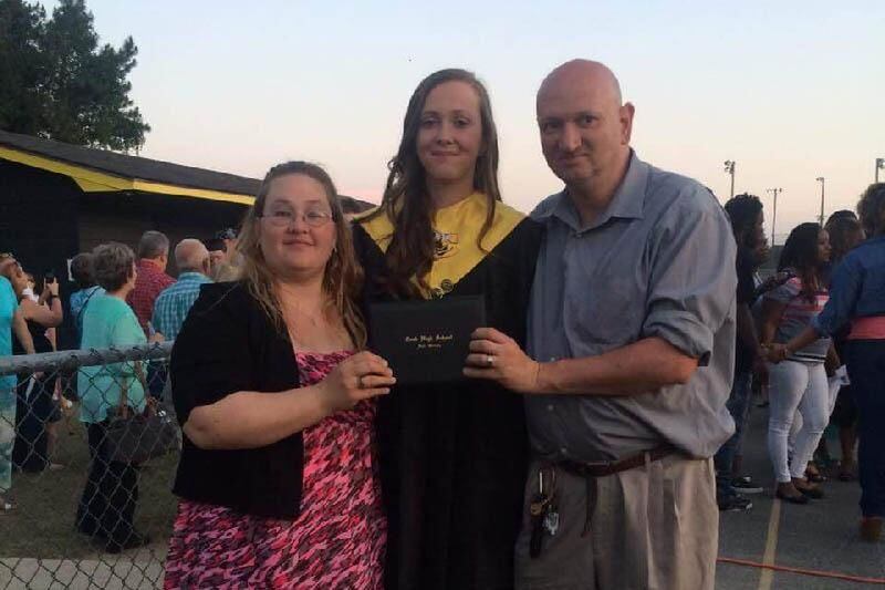 Alexis Livingston was 19. She is shown here with her parents.