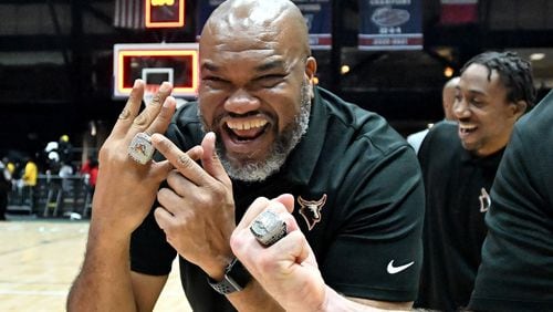Kell’s head coach Jermaine Sellers shows off his championship ring as he celebrates back-to-back championship victory during GHSA Basketball Class 5A Boy’s State Championship game at the Macon Centreplex, Thursday, Mar. 7, 2024, in Macon. Kell won 62-51 over Eagle’s Landing. (Hyosub Shin / Hyosub.Shin@ajc.com)