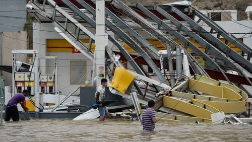 A gas station flooded and damaged by Hurricane Maria. (AP Photo/Carlos Giusti)