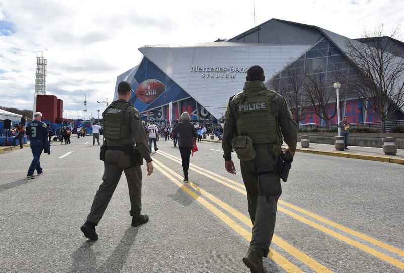 February 3, 2019 Atlanta - Armed police officers are visible outside Mercedes-Benz Stadium ahead of Super Bowl LIII between the Los Angeles Rams and New England Patriots on Sunday, Feb. 3, 2019. (HYOSUB SHIN / HSHIN@AJC.COM)