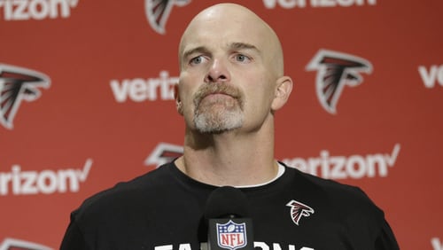 Atlanta Falcons head coach Dan Quinn talks to reporters in a post-game press conference following an NFL football game against the Seattle Seahawks, Sunday, Oct. 16, 2016, in Seattle. (AP Photo/Stephen Brashear)