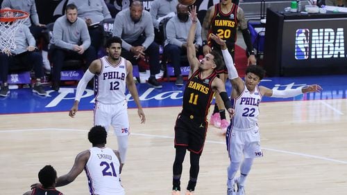 Hawks guard Trae Young drops in a floater for two points against the Philadelphia 76ers at the end of the third quarter of Game 7 of the Eastern Conference semifinals Sunday, June 20, 2021, in Philadelphia. (Curtis Compton / Curtis.Compton@ajc.com)